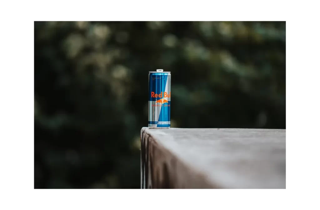 Red Bull can with long drink nutrition facts outdoors.